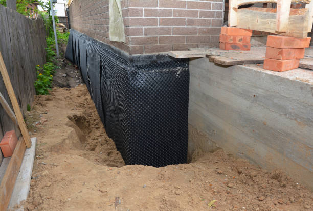 SJ Waterproofing Pros technician performing targeted Waterproofing assessment in Old Bridge, NJ